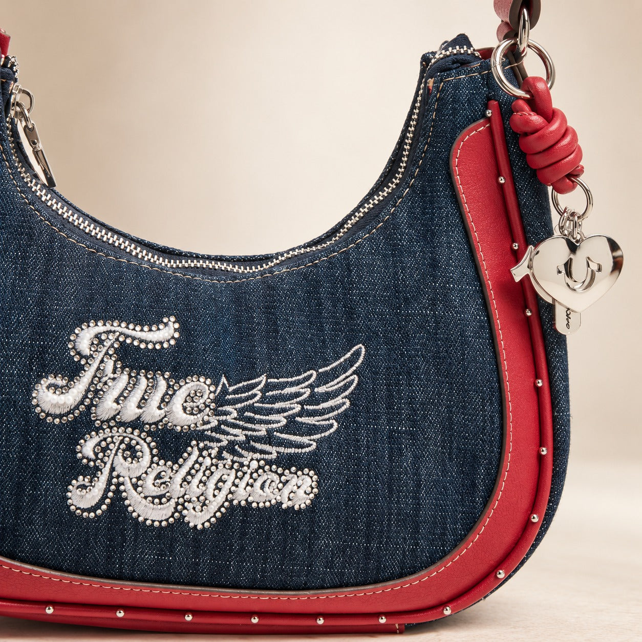 True Religion Blue Denim Hobo Bag, Red Leather Trim, Rhinestone Wing Charm